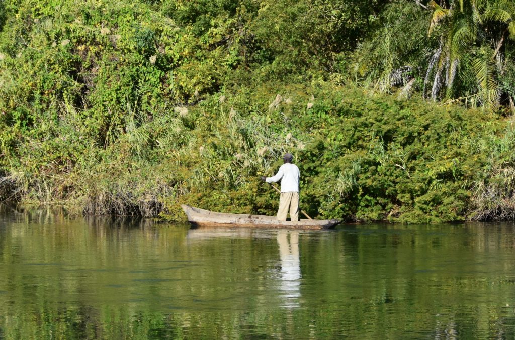 A lone boatman on the Okavango river in the Caprivi strip