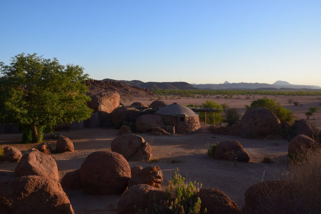 Camp Kipwe huts blended in with the reddish brown rocks